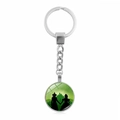 Porte-clés rond en métal argenté avec silhouettes artistiques de Glinda et Elphaba - Silhouette de Double Personnage (XSWX8404-5)