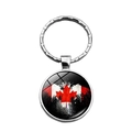 Silver keychain featuring a round glass pendant with a Canadian flag maple leaf design - Abstract Spray Style (XSWX8417-5)