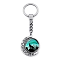 Detail view of silver crescent moon keychain featuring a howling wolf glass pendant - Vintage Aurora Wolf (XSWX8432-12)