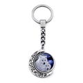 Detail of rotating moon pendant featuring howling wolves on a silver metal keychain - Green Eyes Double Wolf (XSWX8432-8)