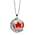 Rotating crescent moon necklace featuring a Canada flag maple leaf emblem in silver finish - Retro Carved Crescent Maple Leaf (XSWX8427-2)