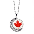 Rotating silver moon necklace with Canadian maple leaf glass pendant on white background - Hollow Crescent Red Maple Disc (XSWX8427-10)