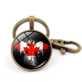 Vintage bronze Canada flag keychain with artistic maple leaf design and lobster clasp - Artistic Splatter Black Background Maple Style (XSWX8420-5) / Antique Bronze