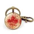 Vintage Canada flag keychain with bronze lobster clasp and grunge maple leaf pendant - Vintage Red Splatter Maple Style (XSWX8420-7) / Antique Bronze