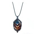 Close-up of gothic oval bat necklace featuring black filigree and orange-blue gradient pendant - Bat Under Moon Style (XSWX8472-2)
