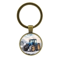 Vintage Bronze-Schlüsselanhänger mit rundem Anhänger und blauem Schneetraktor-Motiv - Antikbronze