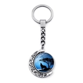 Rotating moon howling wolf keychain with blue lunar silhouette and silver metal finish - Blue Moonlight Wolf (XSWX8432-3)
