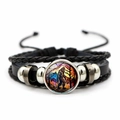 Macro detail of multi-layer leather bracelet featuring Bigfoot forest glass cabochon - Black