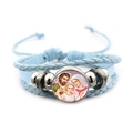Religieuze lichtblauwe leren armband met glazen edelsteen en de Maagd Maria thema - Blauw