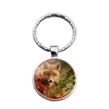 Silver round keychain with a clear glass dome featuring an orange fox in nature - Fox with Red Leaves (XSWX7825-4)