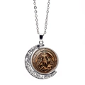 Detailed macro of Archangel Michael moon pendant with silver crescent frame and bronze relief - Bronze Relief Style (XSWX7952-2)