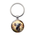 Porte-clés en métal argenté avec pendentif rond d'éléphant fantaisie sur fond blanc - Jeune Éléphant Fantastique à Grandes Oreilles (XSWX7872-15)
