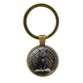 Vintage bronze keychain with black cat and magic book glass pendant on white backdrop - Antique Bronze
