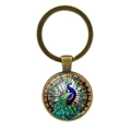 Vintage bronzen pauw kunst glas sleutelhanger met kleurrijk cabochon ontwerp - Antiek Brons