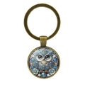Llavero vintage de búho en bronce con gema de cristal azul y detallados motivos florales - Bronce Antiguo