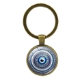 Portachiavi vintage in bronzo con occhio greco blu e bordo con motivo greco antico - Bronzo Antico