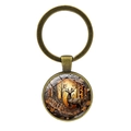 Detailed macro of vintage bronze elk keychain with artistic forest design on glass cabochon - Antique Bronze Autumn Forest Elk (XSWX8209-5)