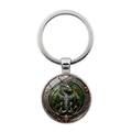 Schlüsselanhänger mit grünem Drachen-Edelsteinanhänger und geprägtem Vintage-Metallrahmen - Silber