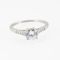 Elegant titanium steel ring with a large round center stone and pave diamond accents - Size 5 / Silver