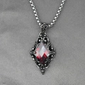 Gothic pendant necklace featuring a vivid red gem and vintage silver pattern - Red Rhinestone Pendant With Box Chain