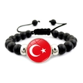 Detail of adjustable black beaded bracelet featuring the Turkish flag national emblem - Turkey