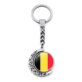 Rotating moon keychain detail with Belgian flag emblem and intricate hollow carving - Belgium Style