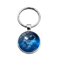 Silver alloy Scorpio zodiac keychain featuring a glass dome with a blue starry sky background - Scorpio
