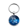 Blue zodiac glass cabochon keychain with silver metal ring and artistic line pattern - Aquarius