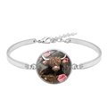 Silver bracelet featuring a Highland cow glass gem charm with floral accents on white background - Pink Floral Highland Cow (XSWX7601-1)