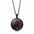 Macro shot of a dark gothic raven glass pendant with a red and black illustration - Black Style 3