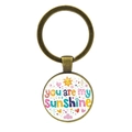 Vintage bronzen You Are My Sunshine sleutelhanger met glazen cabochon en zon illustraties - Antiek Brons