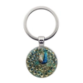 Peacock glass cabochon keychain with vibrant blue and gold enamel bird pattern - Silver