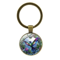 Porte-clés colibri rétro en bronze avec motif floral coloré sur fond blanc pur - Bronze Antique