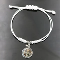 Bracciale intrecciato bianco con medaglia di San Benedetto e campanellino in metallo - Bianco (XSWX7503-1)
