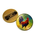 Detail of vintage bronze rooster brooch showing glass cabochon and safety pin back - Rooster Pattern 10 (XSWX6640-10) / Antique Bronze