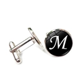 Detail of silver shirt cufflinks with glass cabochon featuring white letter M on black background - Letter M Style