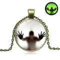 Vintage bronze Halloween luminous necklace with glowing green pendant on white background - Antique Bronze