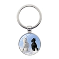Macro shot of a silver horse pendant keychain showing two horses running on snow detail - Horses Running in Snow (XSWX7172-7)