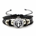 Macro shot of St. Benedict medal and layered black braided leather punk style bracelet - Vintage Saint Benedict Leather Style (XSWX7251-3)