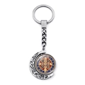 Close-up of Saint Benedict rotating metal medal keychain with silver crescent moon detail - Drip Oil Relief Medal Style (XSWX7260-8)