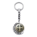 Close-up of a rotating Saint Benedict metal medal on a silver crescent moon keychain - Silver & Gold Tone Rotating Medal Style (XSWX7260-6)