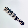 Detail of tortoise shell wide tooth acetate comb with vintage marble texture - Light Leopard