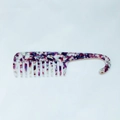 Close-up of wide tooth acetate comb featuring purple marble texture and hanging hook - Purple White