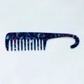 Macro view of blue marble acetate wide tooth hair comb with integrated handle hook - Multicolor Blue Glow