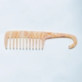 Detail of wide-tooth hair comb with orange and white marble acetate texture and hook handle - Orange White