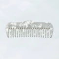 Dettaglio del pettine a denti larghi in acetato con elegante trama in marmo bianco - Bianco