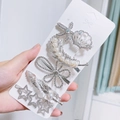 Five-piece silver hair clip set with star, seashell, and pearl charms on a display card - Silver Star Style
