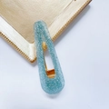 Close-up of light blue glitter water-drop hair clip with golden metal duckbill clip - Waterdrop-Cyan