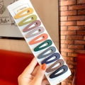 Set of 10 matte drip hair clips in assorted macaron colors on display card - Hollow Teardrop