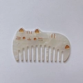Detail of cute cat shaped acetate hair comb with pearlescent finish and golden engraving - Acetate Thickness 2.5mm / Mermaid Color